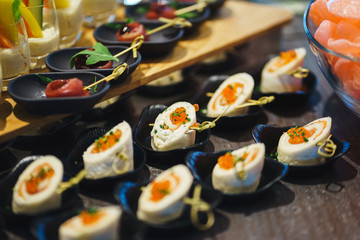 Fresh snacks fish meat, tuna, with greens on the table in restaurant. Top view. 
