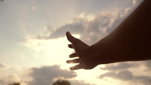 religion hand concept on blue sky background. the man hand stretches lifestyle to god faith and bliss