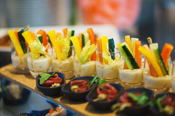 Canapes and light meals, tapas on the table in the restaurant.