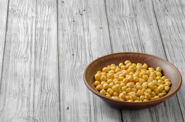 chickpeas raw in a clay plate after soaking