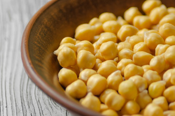 chickpeas raw in a clay plate after soaking
