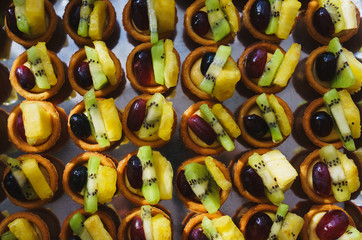 Sweet desserts, pastries on the table during the event. Catering servicing of guests and participants during mass events.