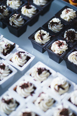 Sweet desserts, pastries on the table during the event. Catering servicing of guests and participants during mass events.