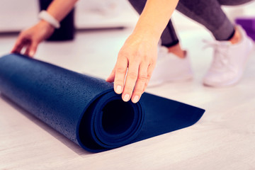 Focused photo on yoga mat that lying on floor