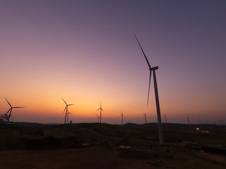 wind turbines at sunset