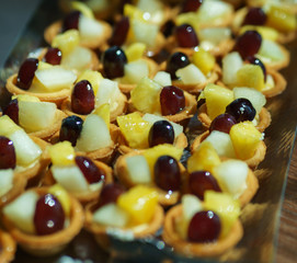 Sweet desserts, pastries on the table during the event. Catering servicing of guests and participants during mass events.