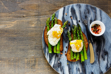 Fototapeta na wymiar Toasts with aspargus and eggs