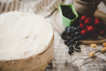 beautiful white cream cheese cake with different summer berries