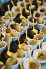 Canapes and light meals, tapas on the table in the restaurant.