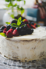 beautiful white cream cheese cake with different summer berries