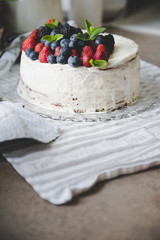 beautiful white cream cheese cake with different summer berries
