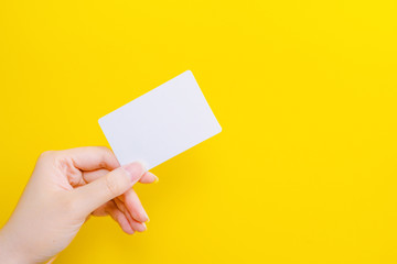 web banner design for business manner and activity concept with beauty woman hand hold name card or credit card in left hand with yellow pastel background