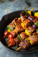 Grilled meat kebab with vegetables