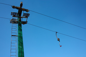 ski lift or skilift. cable car pole on snow slope in summer.