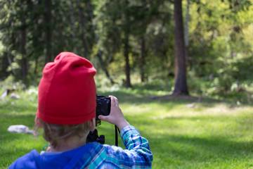 boy in park with camera