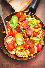 Chorizo, chickpeas, tomato, lemon and basil dish