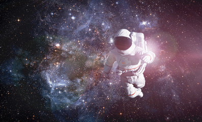 Astronaut exploring outer space conducting spacewalk. © Photocreo Bednarek