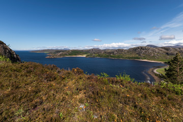 A summers day by the sea and beach at Gruinard Bay in Wester Ross, Highlands, Scotland.