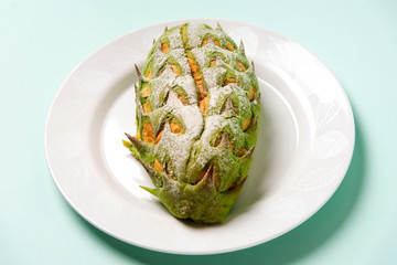 Durian shaped fruit bread on a plate