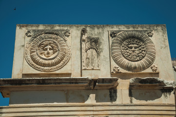 Fototapeta na wymiar Mythological face carved in marble block at the Roman Forum in Merida