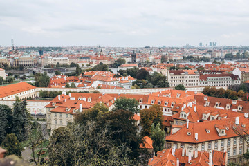 Fototapeta na wymiar Prague panorama with red tiled roofs. cityscape skyline of Prague Czech Republic. Tile roofs of the old city