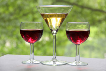 Vintage glass goblet on green background