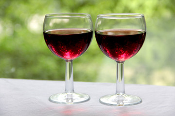 Vintage glass goblet on green background