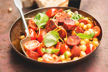 Fried chorizo sausage with chickpeas, tomatoes & basil 