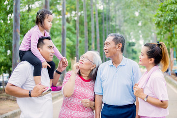 Little girl conversing with her family on the road