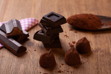 pieces of chocolate on wooden background