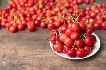 berries, cherry, red sweet cherry on a wooden table, summer