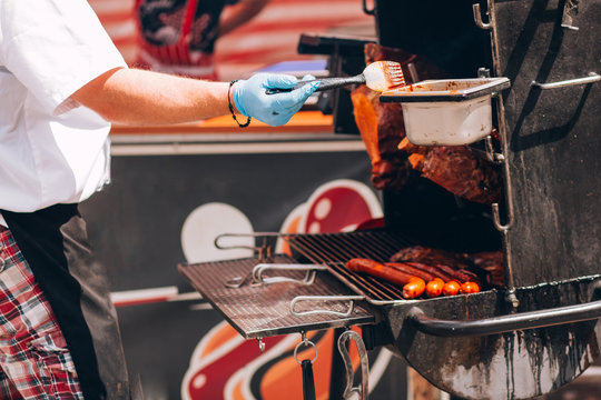 pork grill (mooping) is pork is grill with oil on a brazier in the street in the summer.The men doing pork grill.