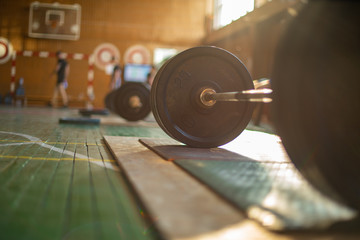Obraz na płótnie Canvas barbell in the gym on the floor