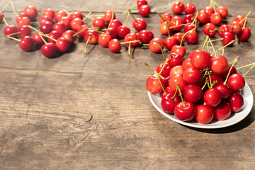 berries, cherry, red sweet cherry on a wooden table, summer