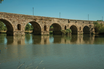 Fototapeta na wymiar Puente Romano arches on the Guadiana River at Merida