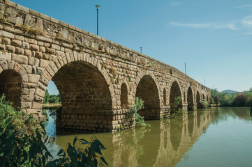 Fototapeta premium Puente Romano arches on the Guadiana River at Merida