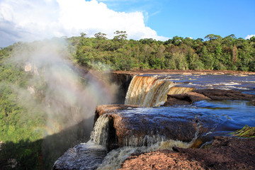 View of the river East Berbice front of the Kaieteur falls, Guyana. The waterfall is one of the most beautiful and majestic waterfalls in the world, the water of the Potaro river falls from a height o