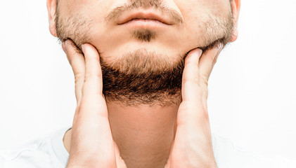 Obraz premium Before and after facial hair of a man on a bright white background. The concept of personal hygiene in a man. A man with a beard and no beard. Shaving and taking care of facial hair.