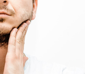 Fototapeta premium Before and after facial hair of a man on a bright white background. The concept of personal hygiene in a man. A man with a beard and no beard. Shaving and taking care of facial hair.