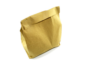 Obraz premium Simple paper bag for food. The package closed, and inside prepared food