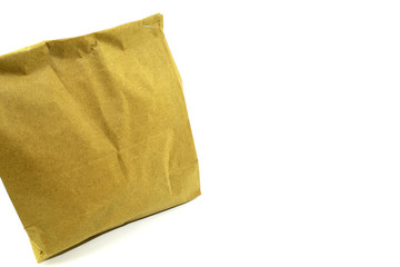 Paper bag closed tightly with products from the store inside