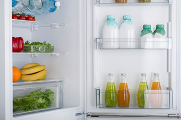 Open fridge full of fresh fruits and vegetables