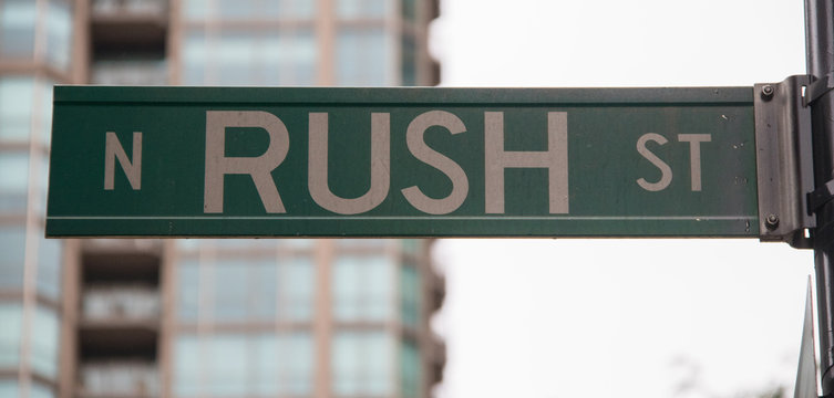 A Sign Depicting Rush Street In Chicago, Illinois