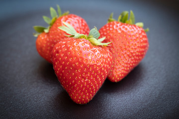 Strawberries on dark background. Vegan food.- Image