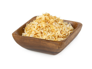 Dried onion in wooden bowl isolated on white