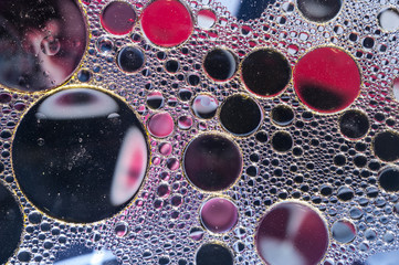 Colourful oil ink bubbles and drops. Abstract template mixed texture background. Wallpaper pattern.