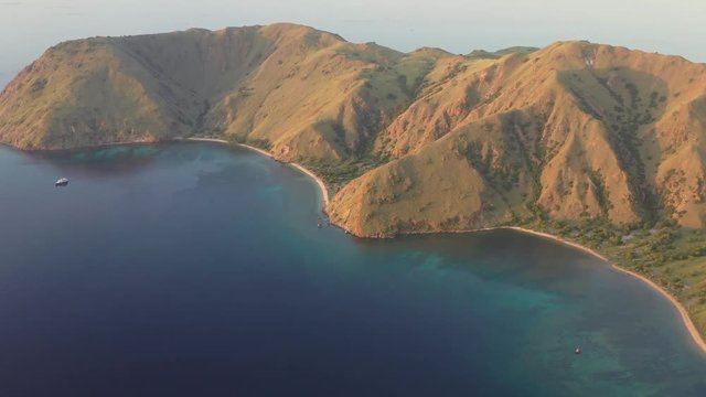Late afternoon light illuminates the scenic island of Gili Banta, just outside of Komodo National Park, Indonesia. This tropical area is known for its marine biodiversity.