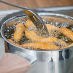 Cooking churros, pastry.