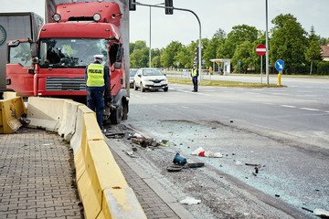 View of truck standing on the side of the street after road accident .