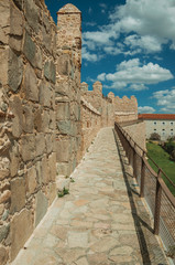 Pathway over old thick wall encircling the town of Avila